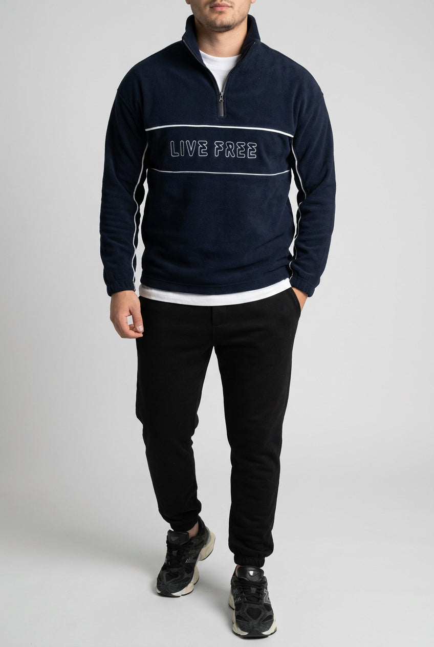 Pull polaire homme à liserés et inscription – Bleu marine