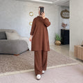 Ensemble femme à tunique longue à capuche et boutons latéraux
